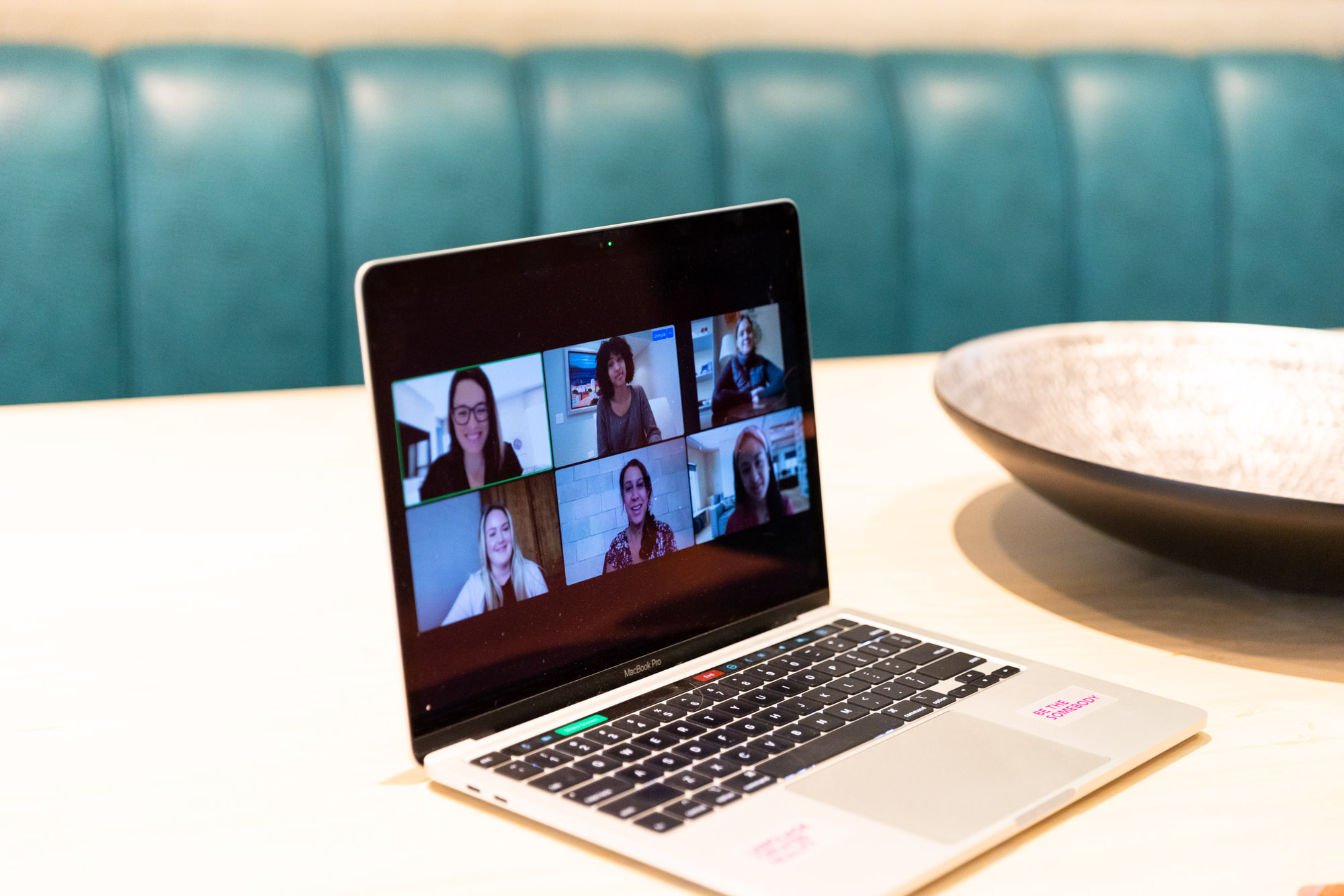 Laptop showing an online meeting to discuss employee engagement statistics