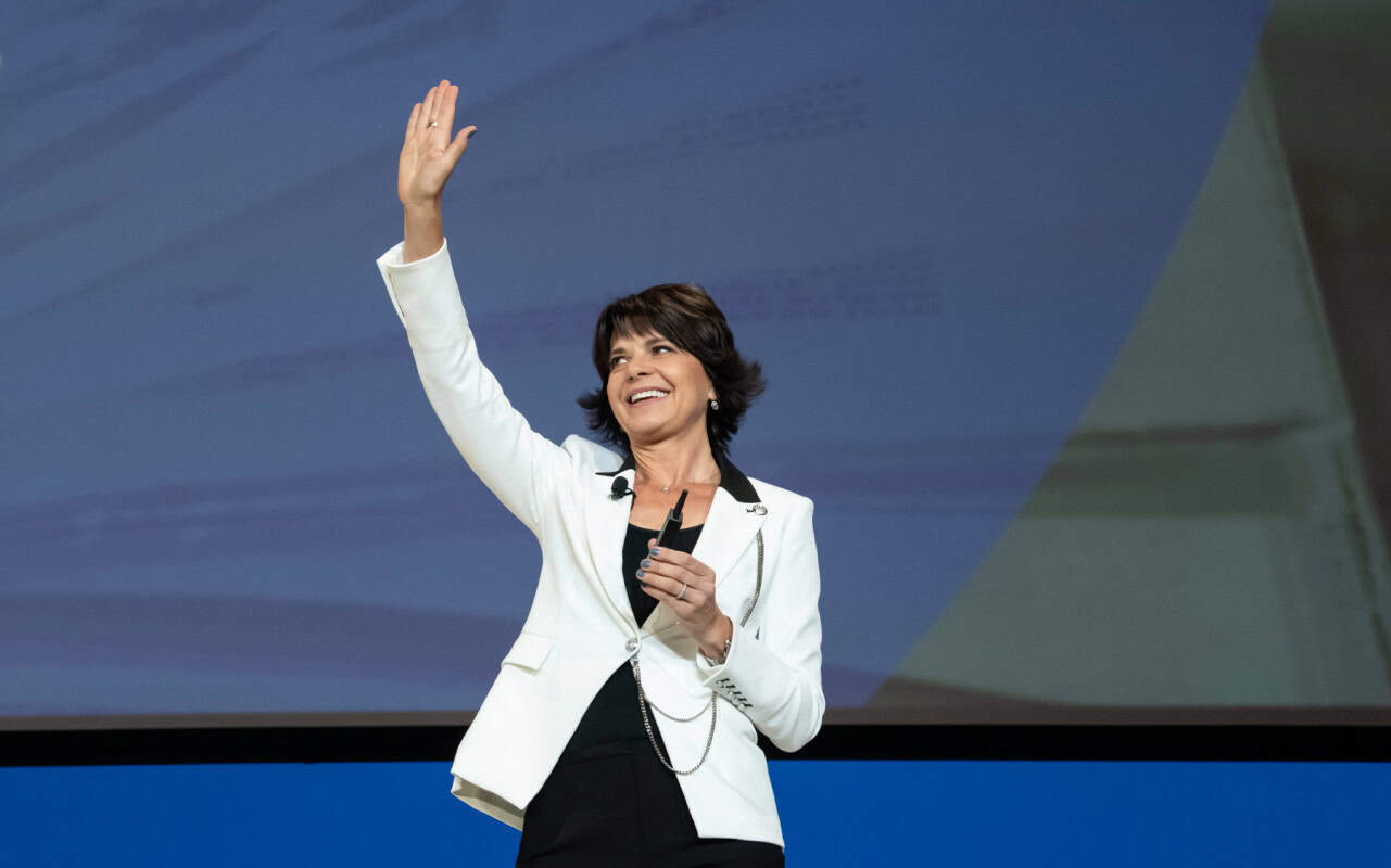 Female woman leading motivational speakers on a stage